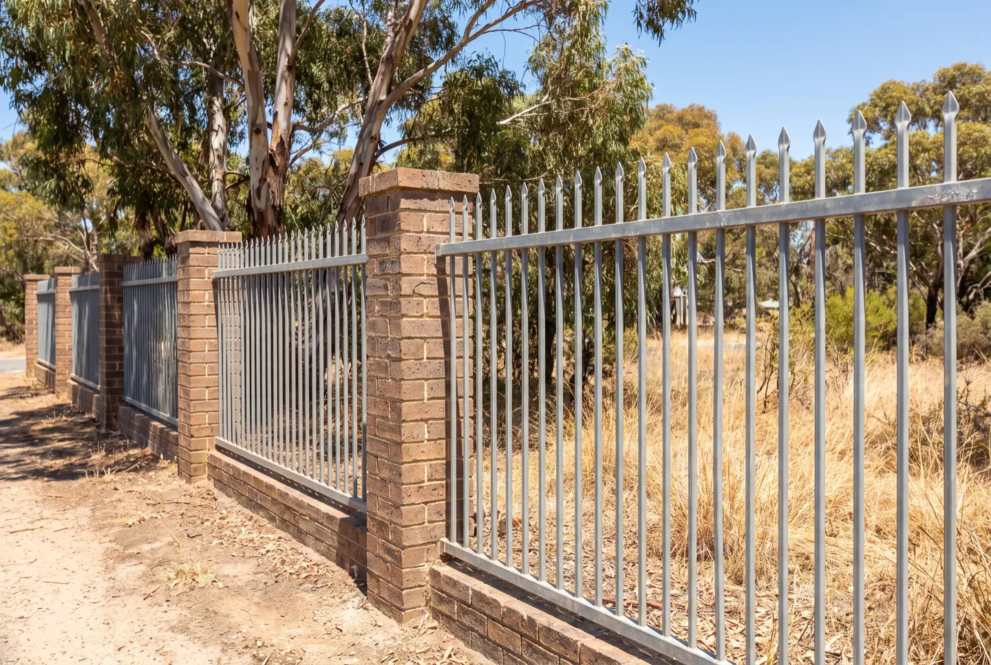 Press-formed spear-top steel fencing